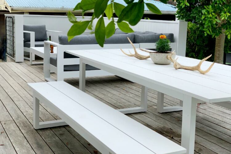 matching white outdoor table and sofa