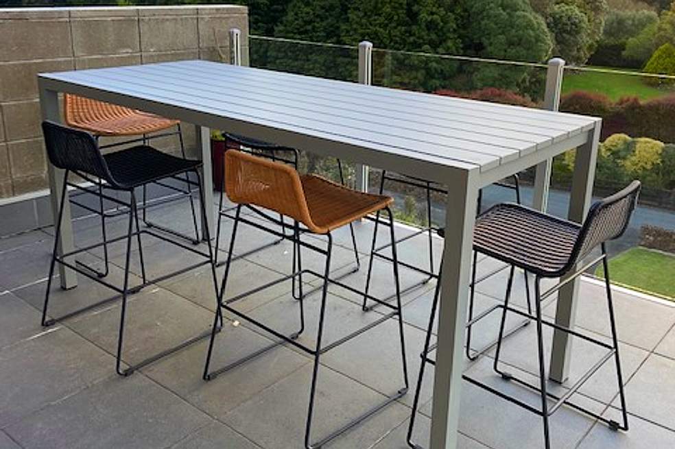 long outdoor bar table set for modern home