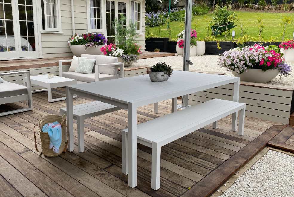 modern white outdoor dining table and benches
