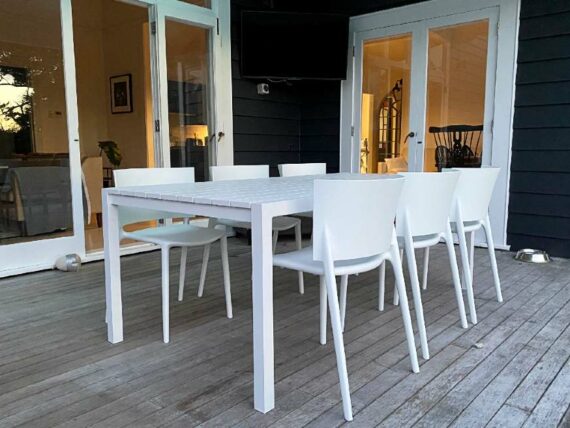 tasteful white outdoor table and chair set