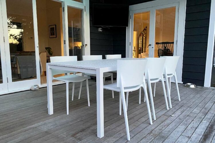 tasteful white outdoor table and chair set