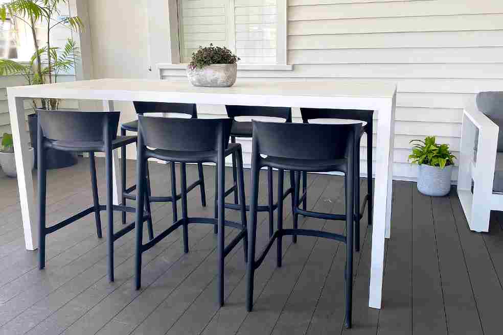 long white outdoor bar table and chairs