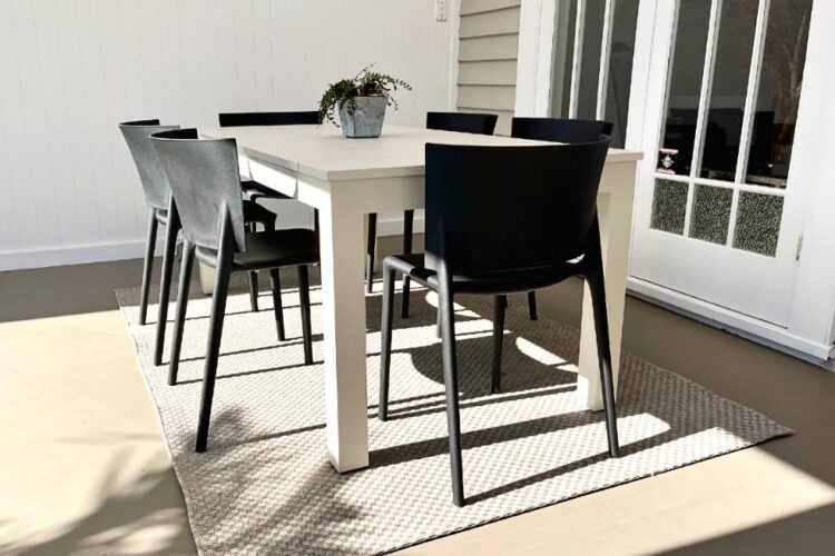 premium bone outdoor table and black chairs nz