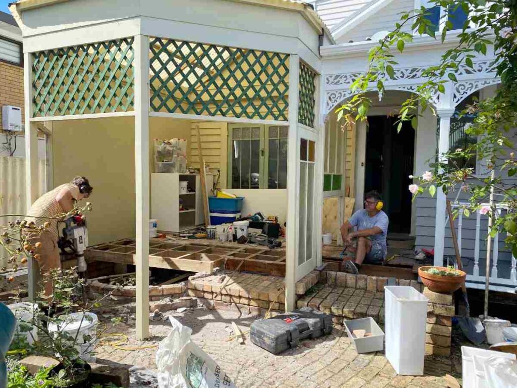 Dated rotunda-style outdoor area with peach tiles before renovation by Outside Space NZ.