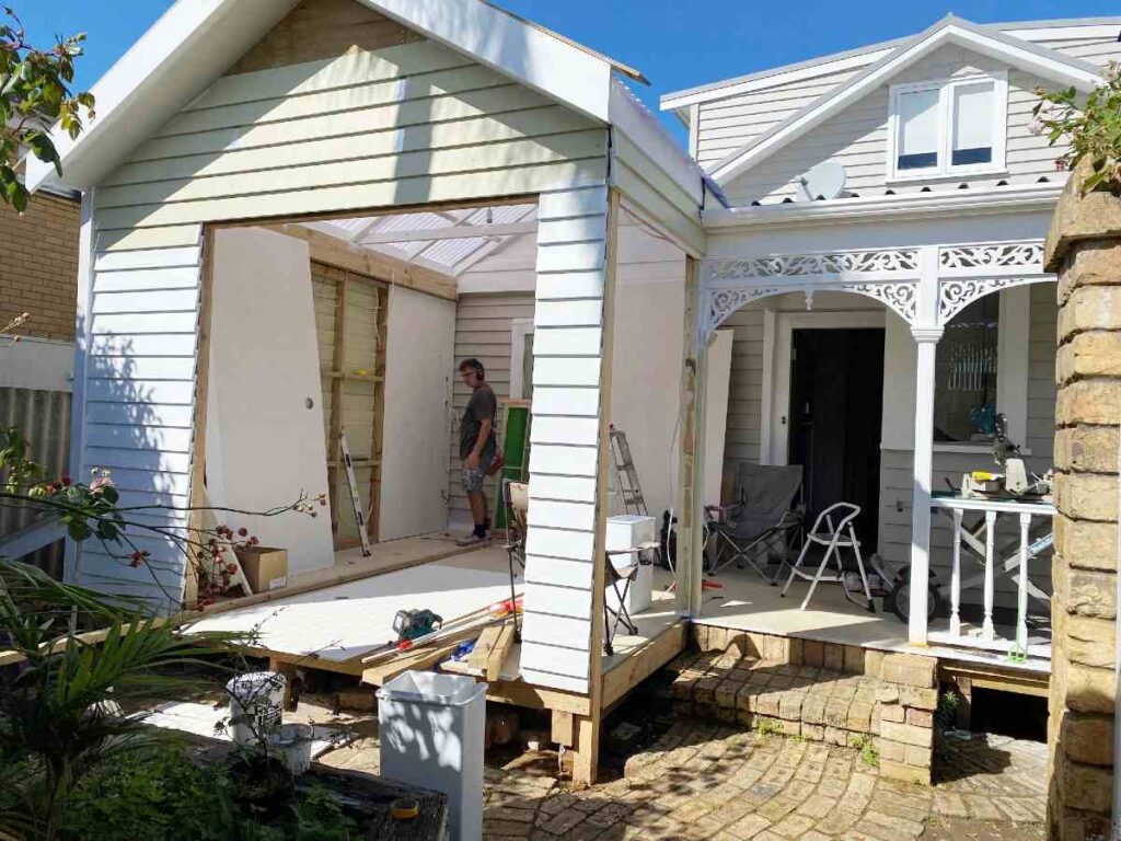 cladding outer walls with matching weatherboards to restore villa character in outdoor room.